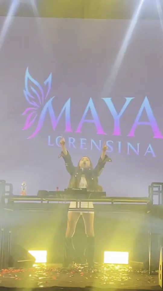 DJ Maya Lorensina performing under her logo on the LED wall